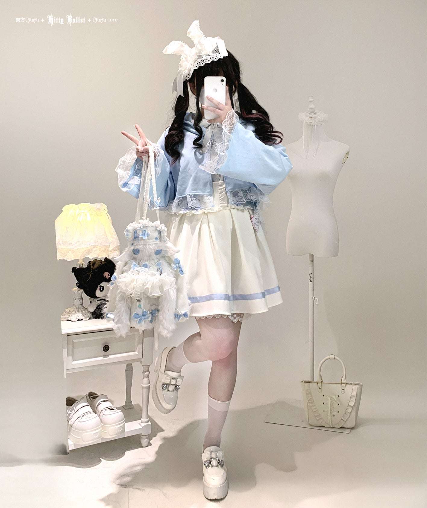 Person in a pastel outfit with a white background