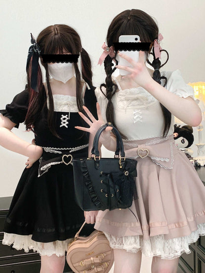 Two individuals in Lolita fashion outfits with handbags.