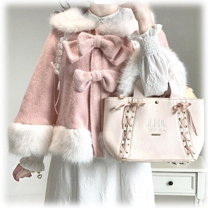 Pink coat with white fur trim and matching handbag held by a person.