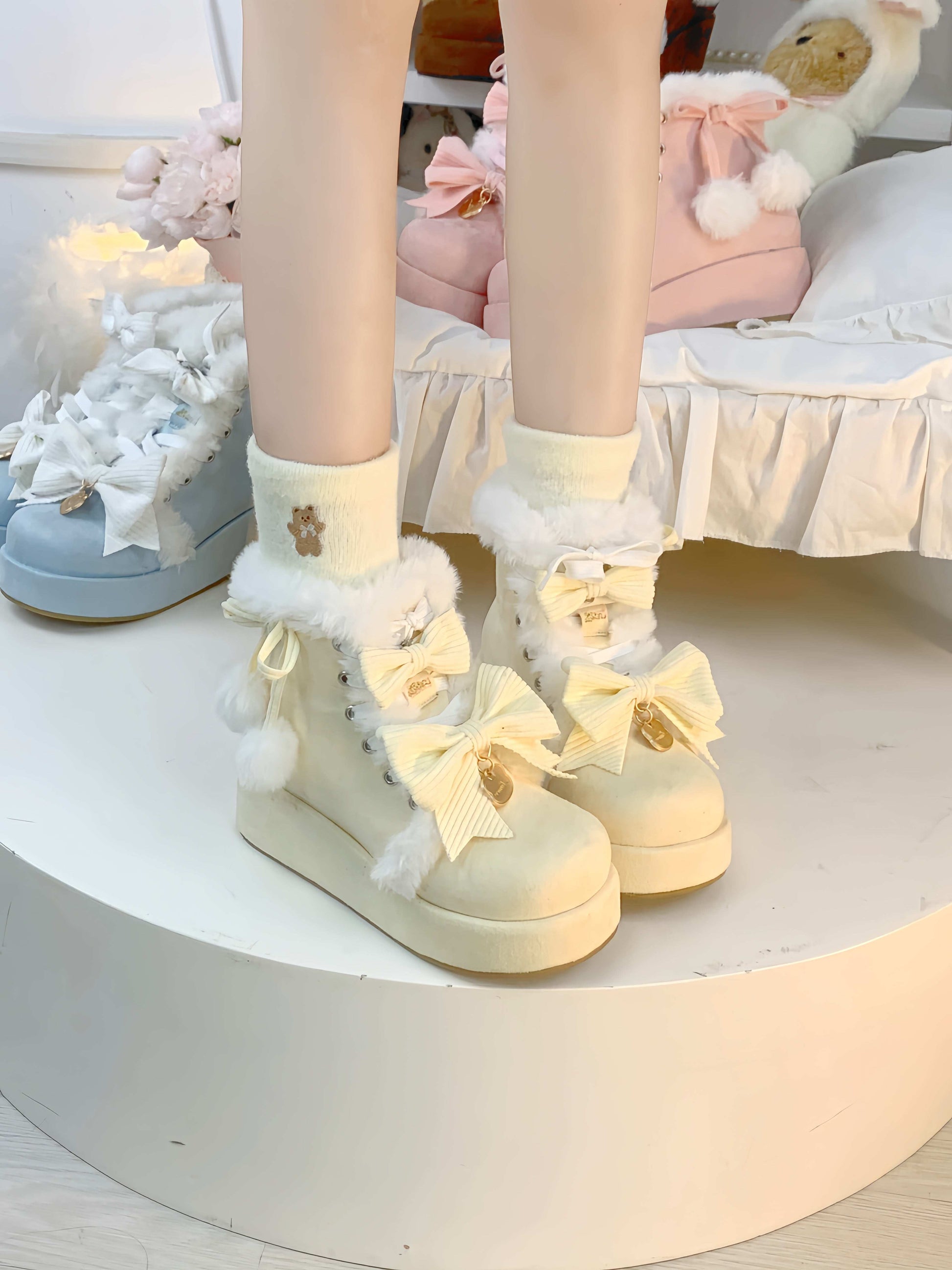 Pastel-themed room with light-colored shoes and socks featuring bows.