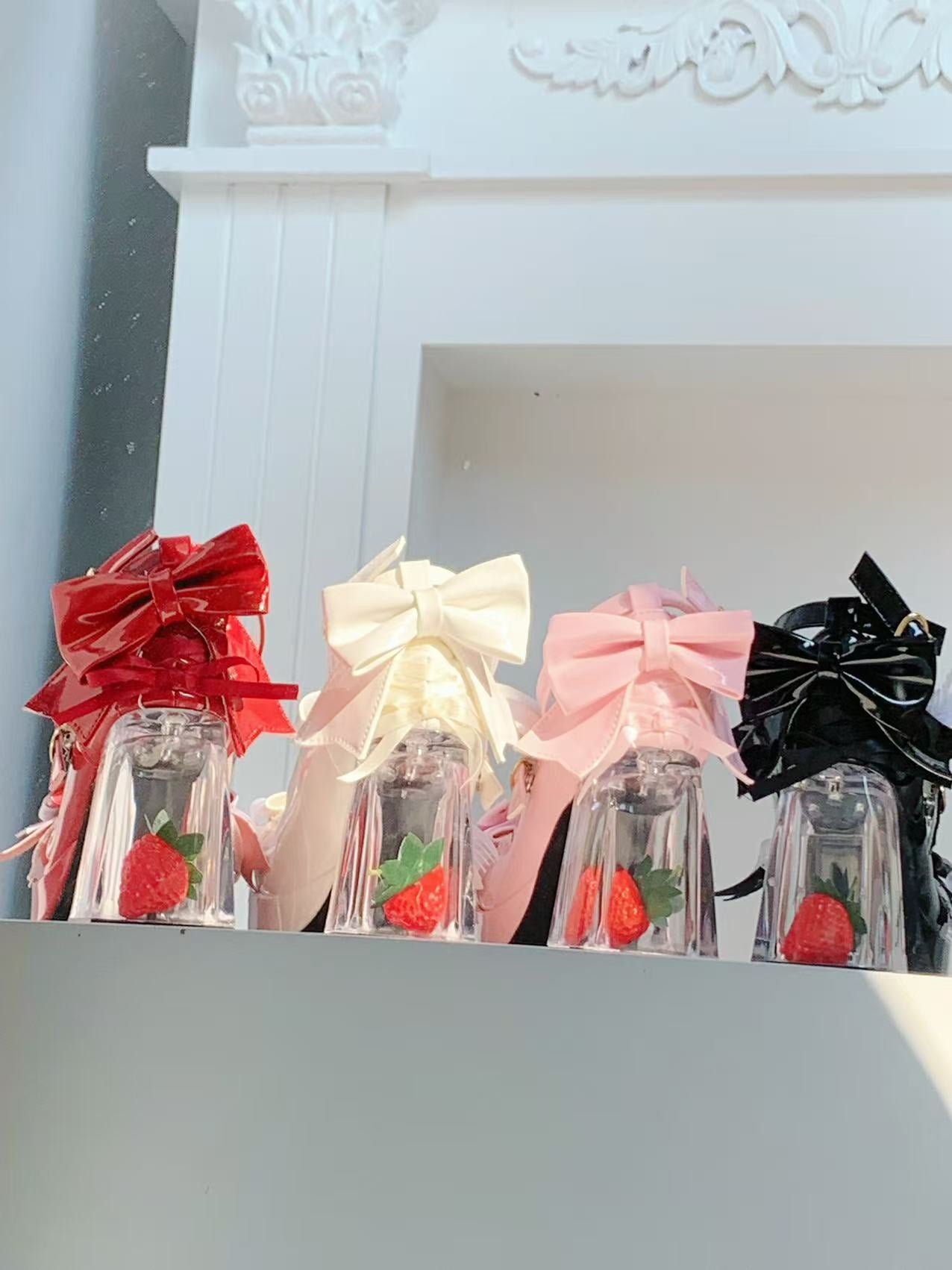 Lolita style high heels with clear glass heel and red strawberry inside