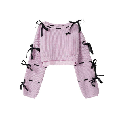 Pink outfit with black ribbons on a white background