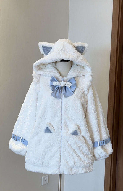White plush jacket with cat ears and a bow on a mannequin against a neutral wall.