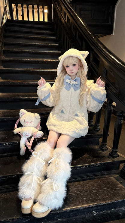 Person in a fluffy costume sitting on a staircase with a teddy bear.