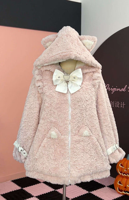 Pink fluffy coat with a large bow on a mannequin against a black and pink checkered floor.