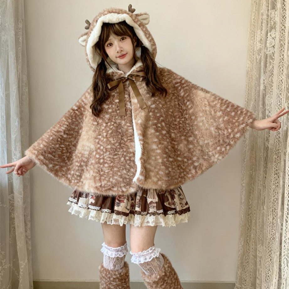 Person wearing a brown deer cape and skirt with white accents indoors.