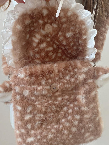 Brown and white patterned fabric with a button on a white background