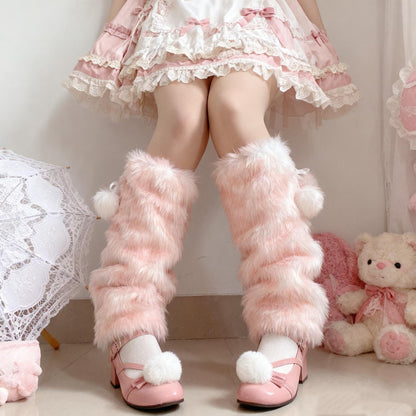 Person wearing pink fluffy deer pattern pink  leg warmers and shoes with a teddy bear and lace curtain in the background.
