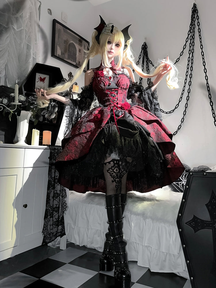 Person in a gothic Lolita outfit sitting on a bed in a room with chains and decorative items.
