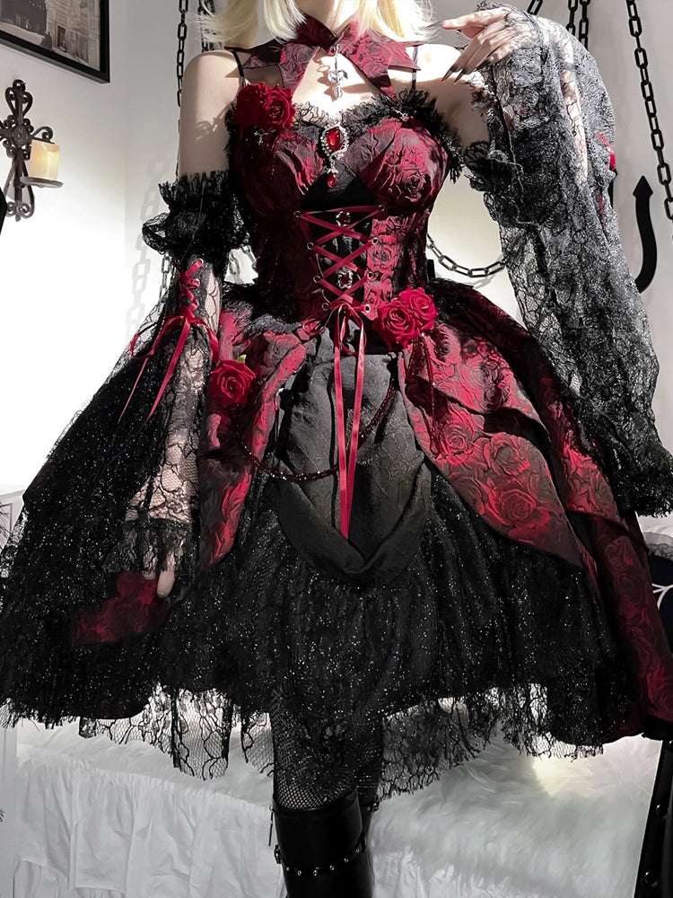 Person wearing a gothic-style dress with red floral accents and black lace details.