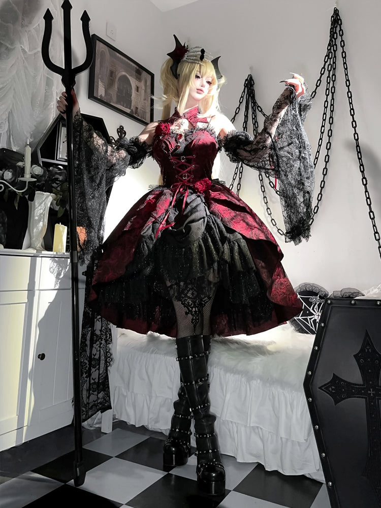Person in a gothic costume with a red and black dress, standing in a room with chains and a cross.