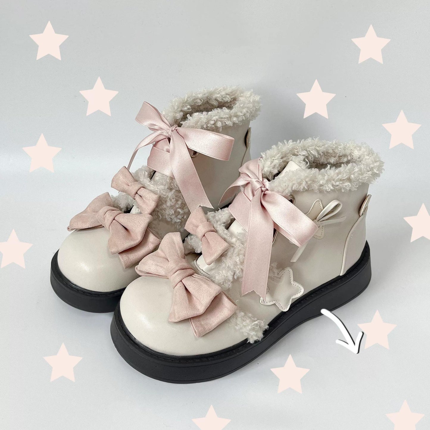 White lolita style boots with pink bows on a light gray background with star decorations