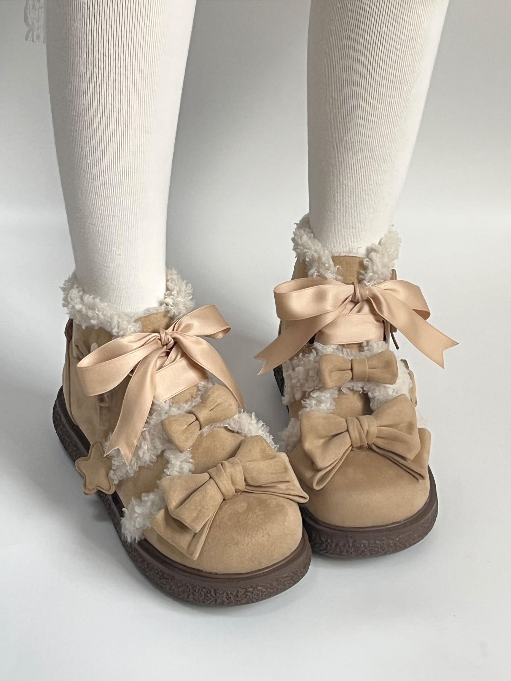Tan suede lolita style shoes with large bows worn with white tights on a light gray background
