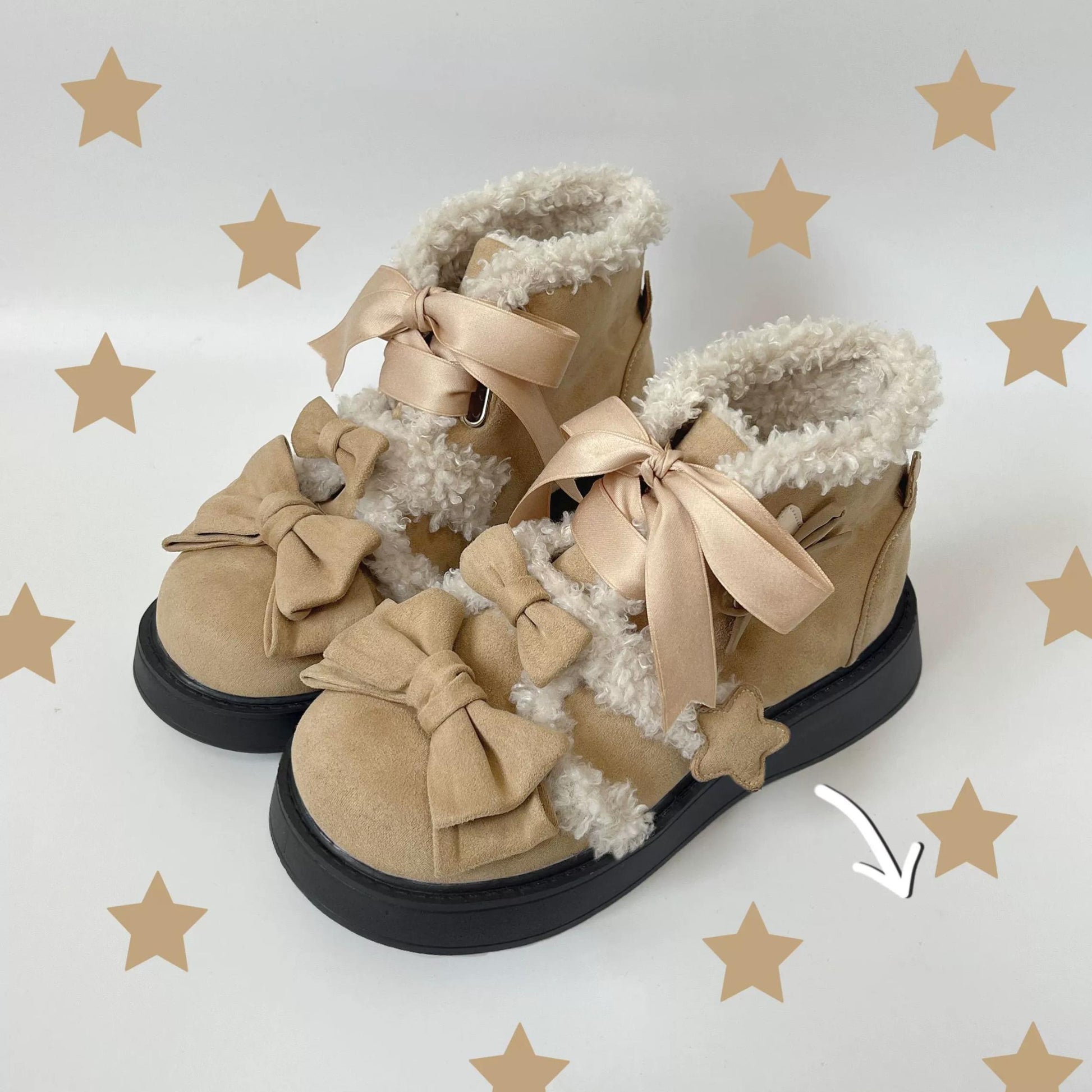 Tan lolita style boots with decorative bows on a light gray background with star patterns