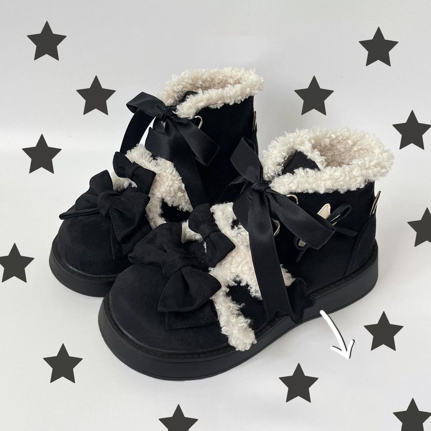 Black lolita style boots with white fur and bows on a gray background with star patterns