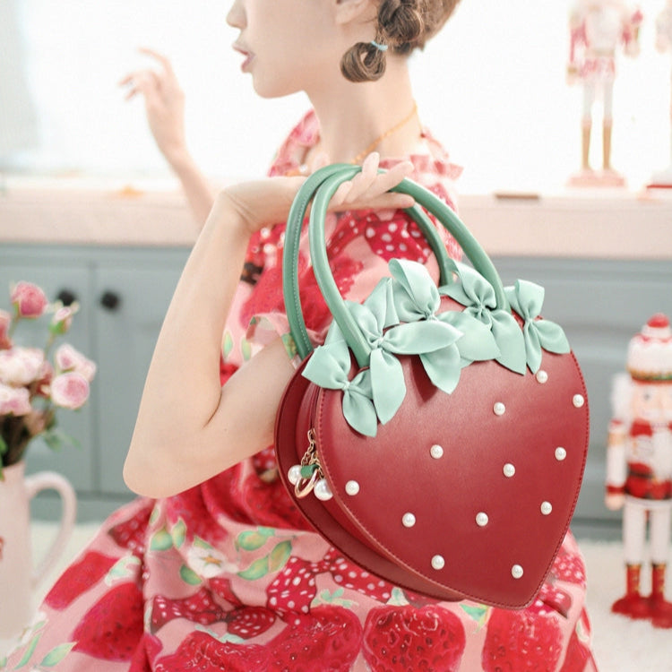 oversized strawberry-shaped bag decorated with small pearls in red