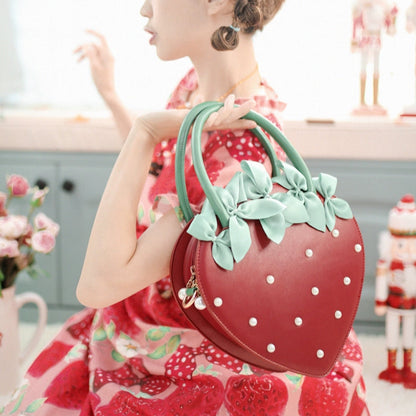 oversized strawberry-shaped bag decorated with small pearls in red