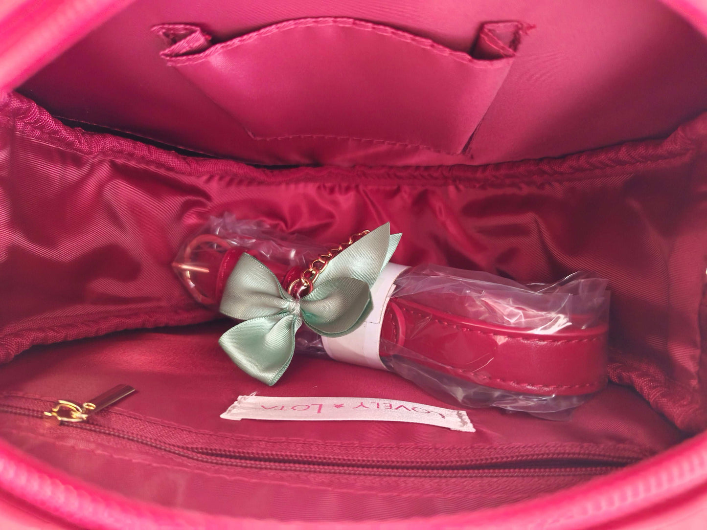 cute strawberry bag in dark red with pearl accents and spacious interior