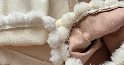Close-up of a textured fabric with white and beige colors