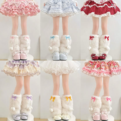 Set of four dolls wearing different outfits with matching leg warmers on a white background.