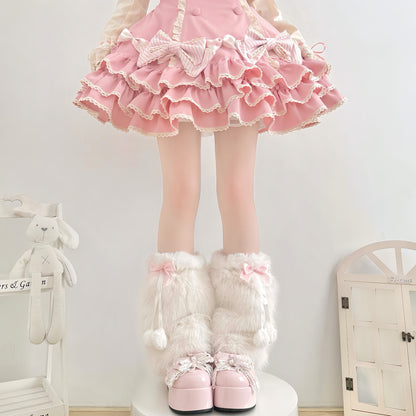 Person wearing a pink ruffled skirt and white fluffy boots in a room with a white wall and wooden floor.
