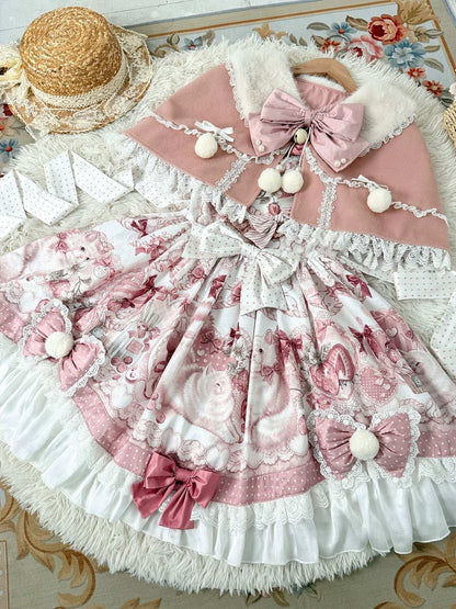 Delicate pink and white dress with floral patterns and decorative bows on a patterned surface.