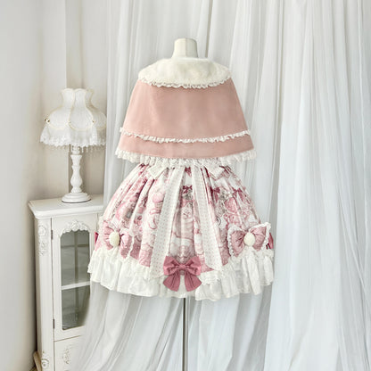 Lolita-style dress on a mannequin against a white curtain background