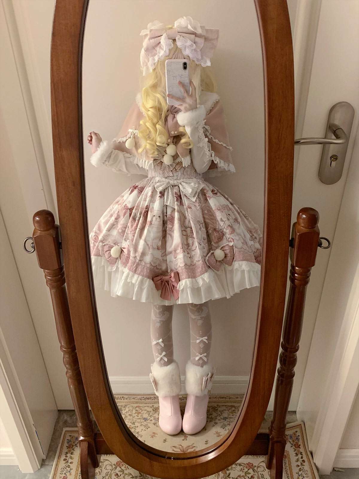 Person wearing a detailed outfit in front of a mirror