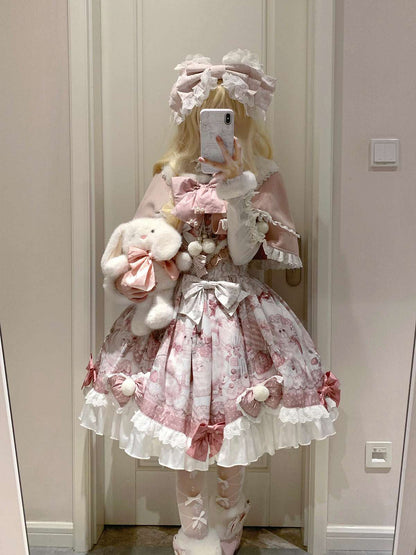 Person wearing a pink and white Lolita outfit with a teddy bear, standing in a room.
