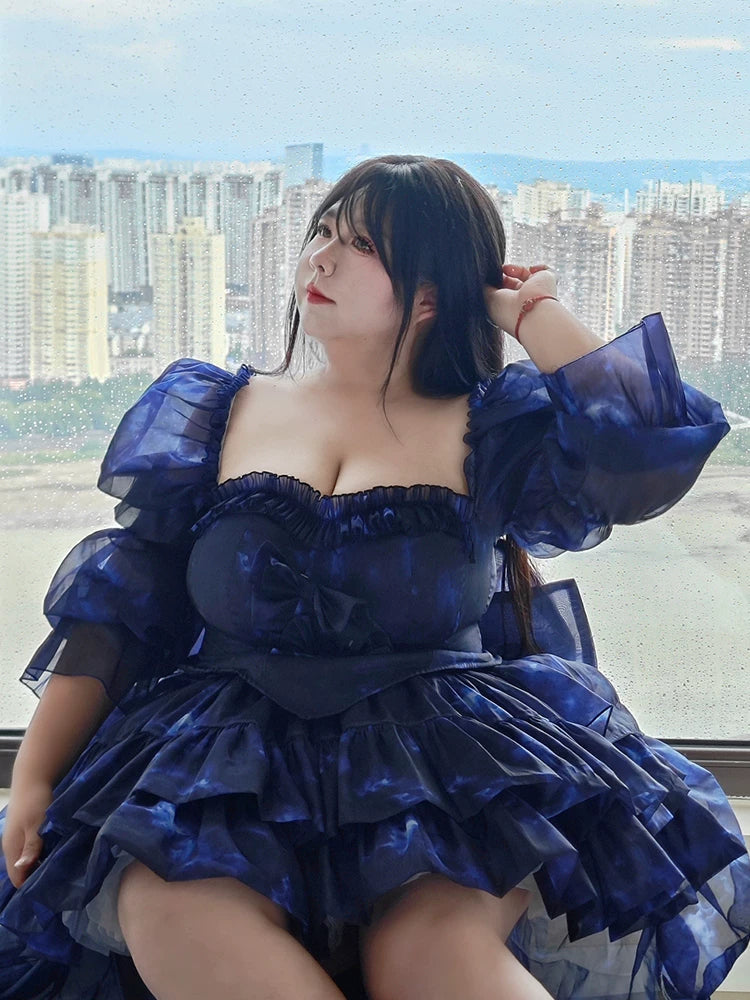 Plus Size Woman in a blue dress with a cityscape in the background