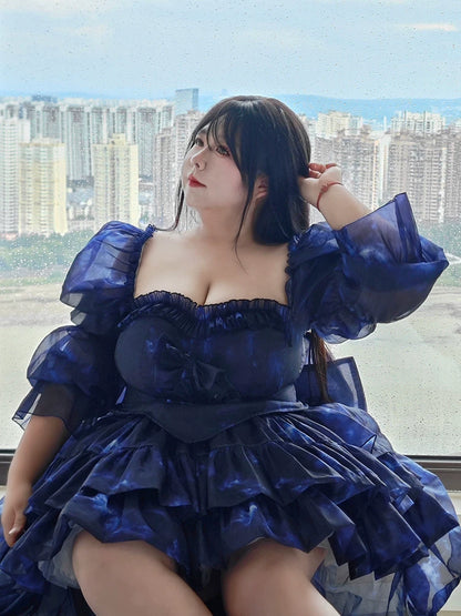Plus Size Woman in a blue dress with a cityscape in the background