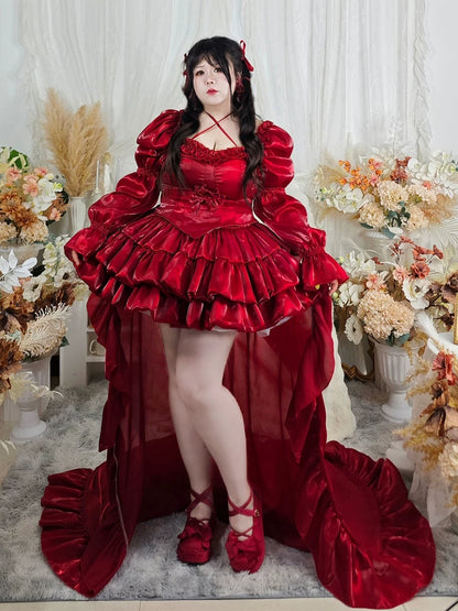 Plus size girl wearing a red ruffled dress in a decorated room with flowers.