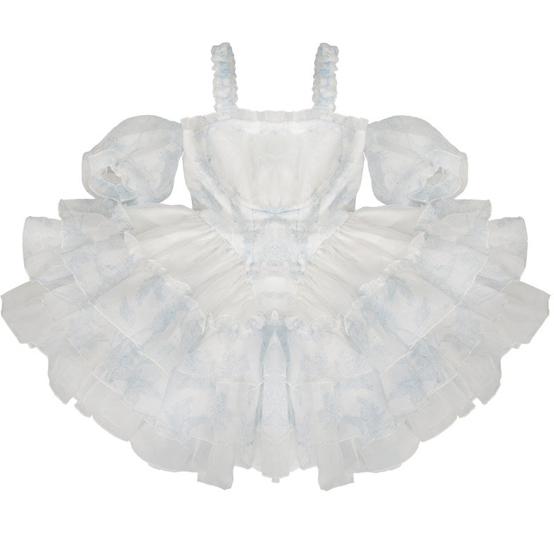 White dress with ruffled layers on a white background