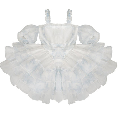 White dress with ruffled layers on a white background