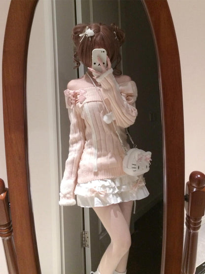 Person wearing a pink outfit with a white dress and holding a phone, standing in front of a mirror.