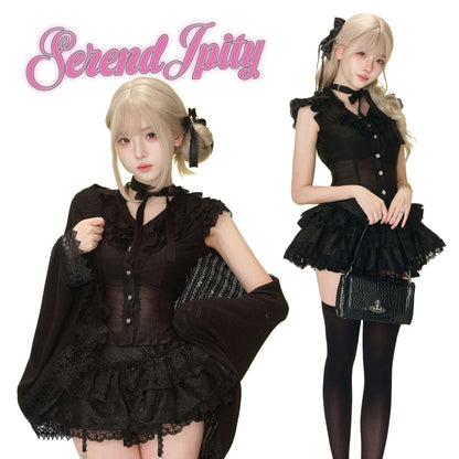 Two women in black outfits with lace details, posing against a white background.