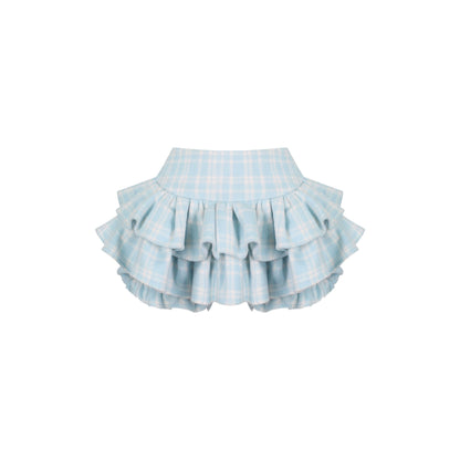 Light blue checkered skirt with ruffled layers on a white background