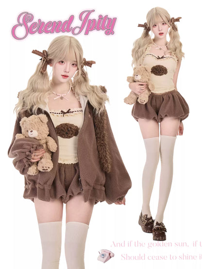 Two women in matching outfits with teddy bears, featuring the brand 'Serendipity'.