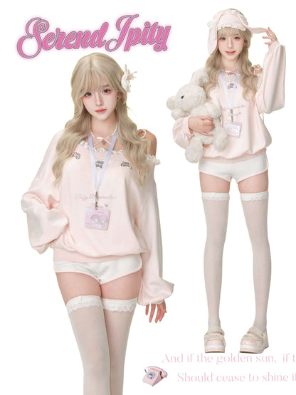 Two people wearing matching pink outfits with white stockings, holding a plush toy, on a white background