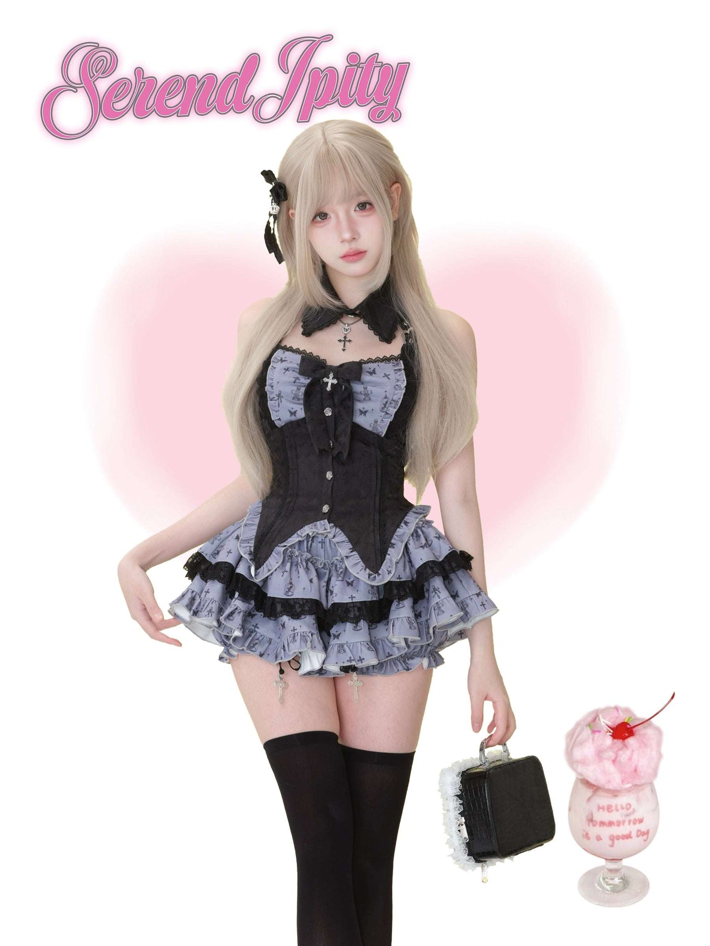 purple halter-neck vest with butterfly print and black trim