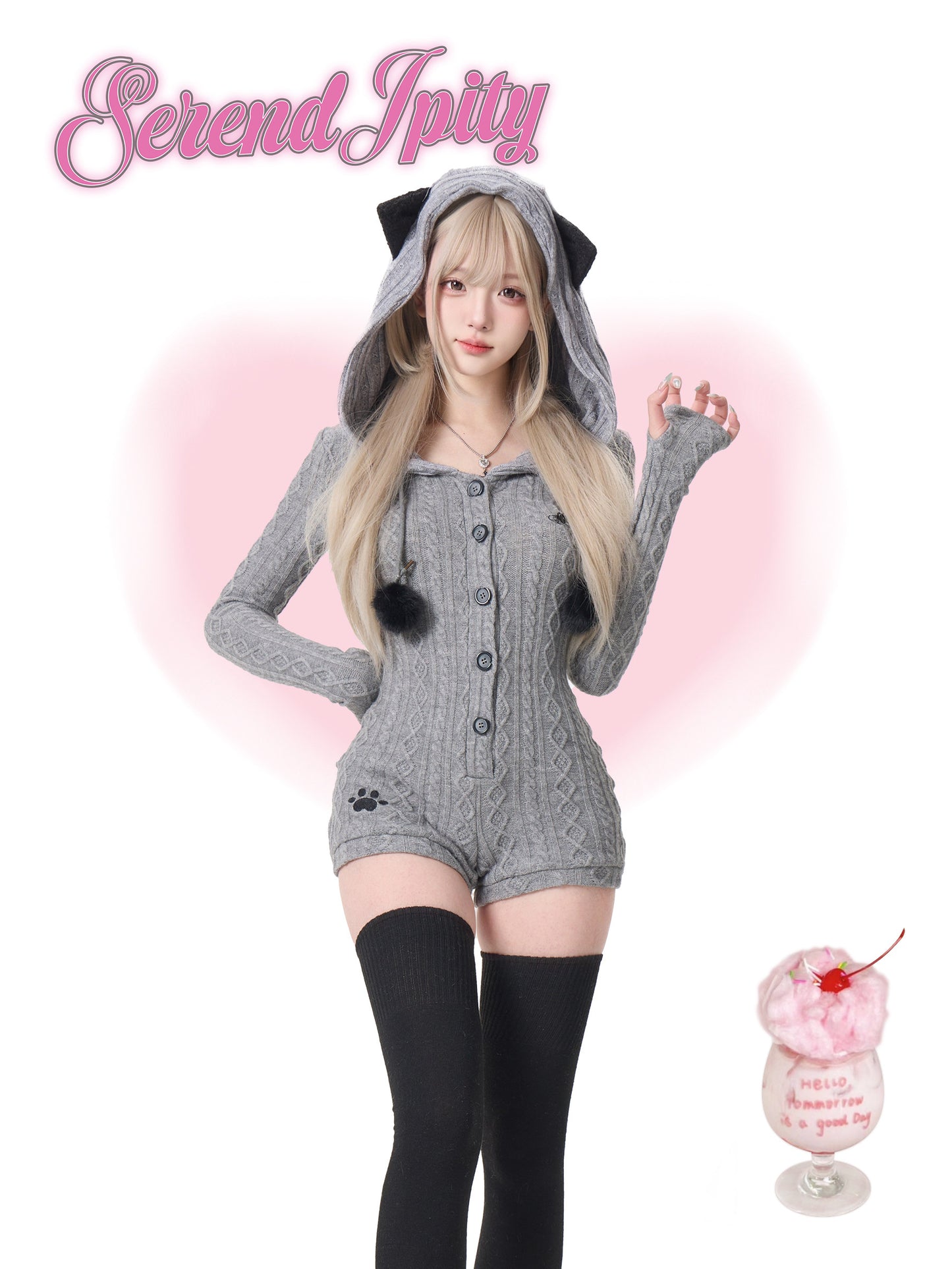 Person wearing a gray cat-themed outfit on a pink background.