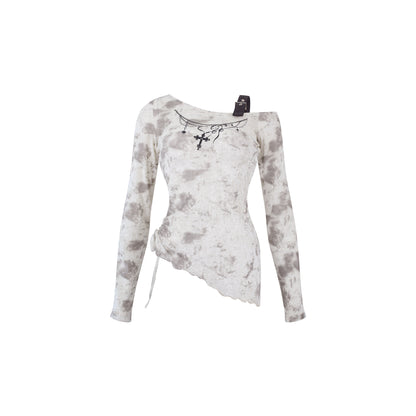 Long-sleeve top with camo pattern on a white background