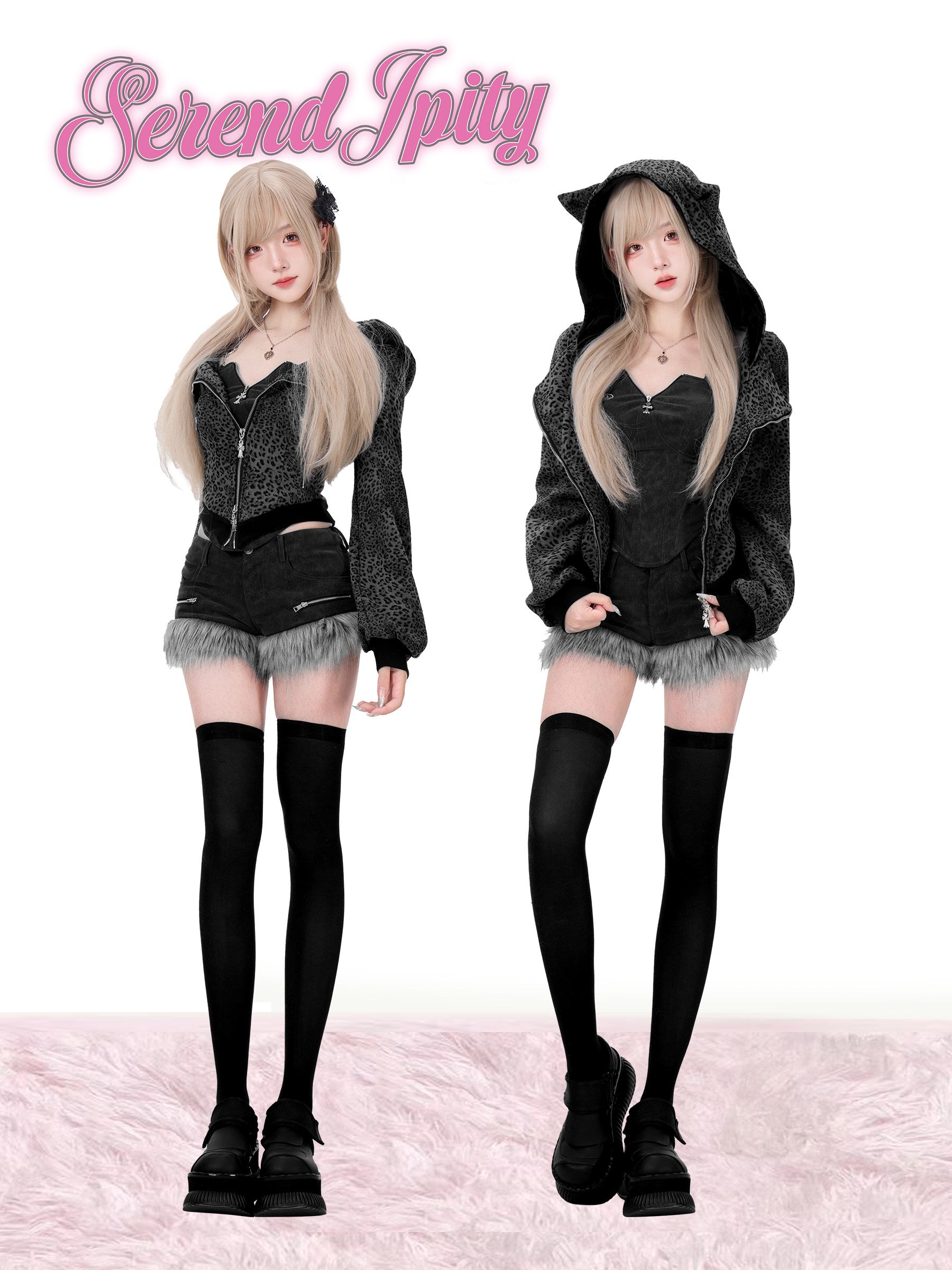 Two individuals wearing matching black outfits with gray accents on a white background