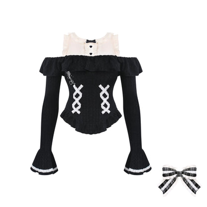 Black and white outfit with ruffled top and flared pants on a white background