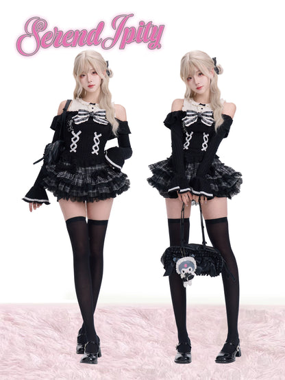 Two women in black and white skeleton-themed outfits