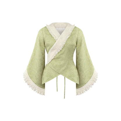 Light green kimono top with white trim on a white background