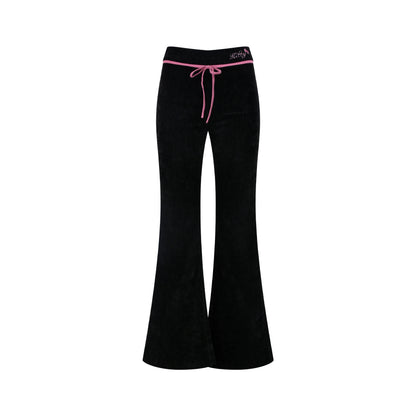 Black bell-bottom pants with pink drawstring on a white background