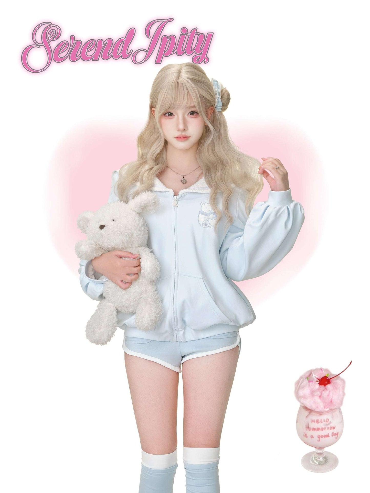 A person wearing a cute light blue tracksuit.