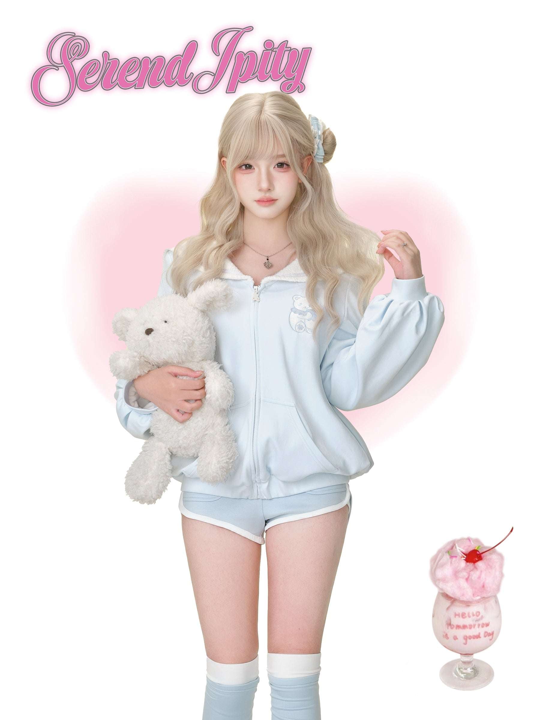 A person wearing a cute light blue tracksuit.