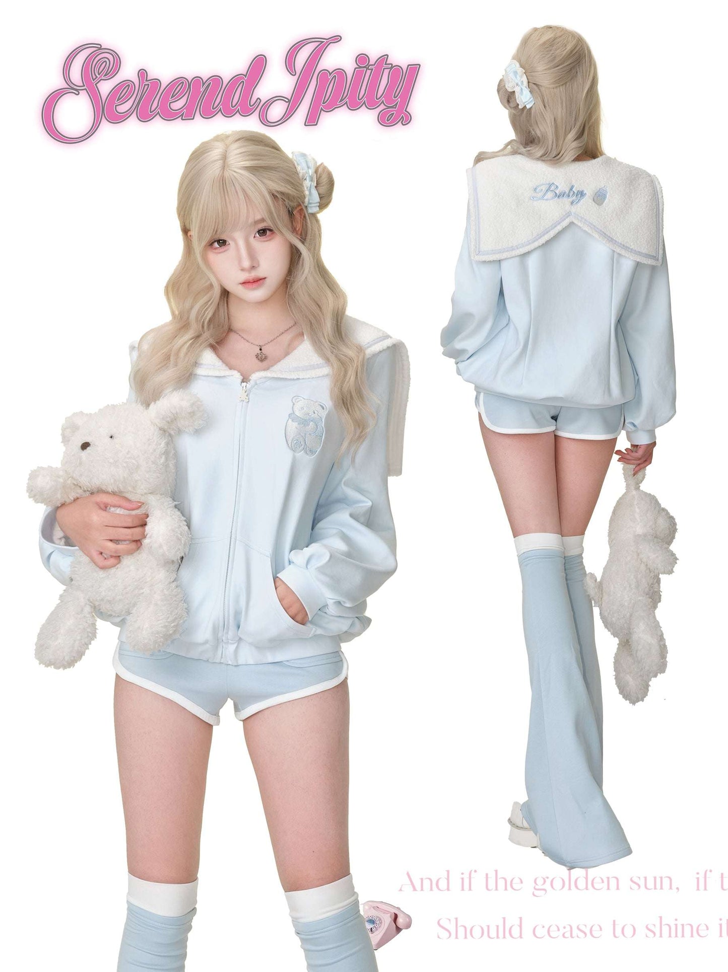 Person wearing a light blue tracksuit with a teddy bear, holding a plush toy.